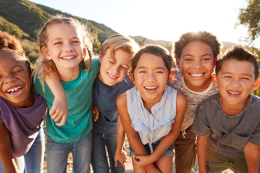 line of happy school aged children