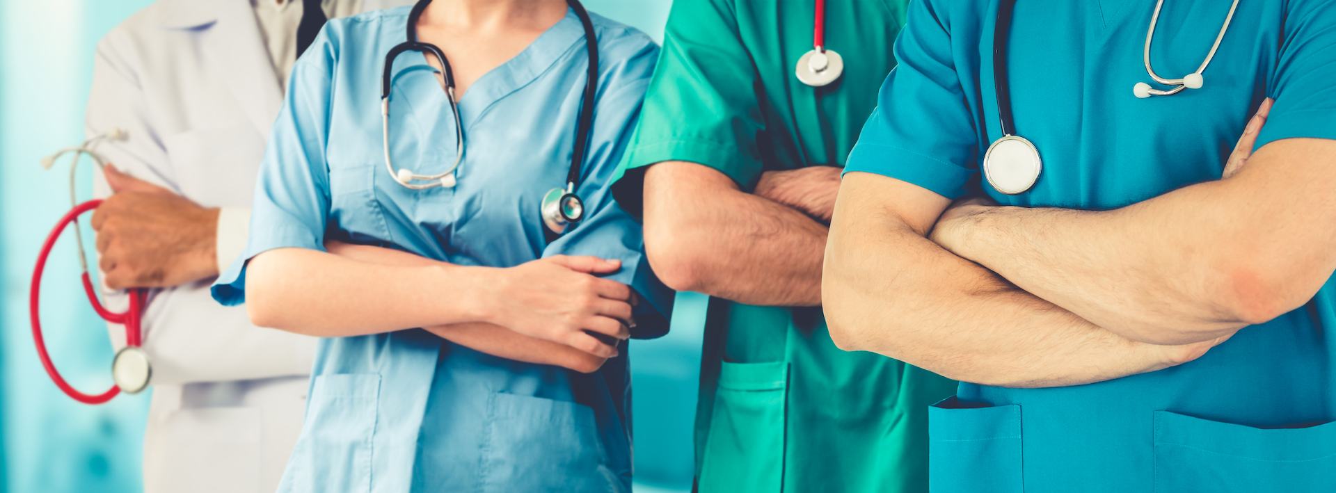 nurses with crossed arms as a team