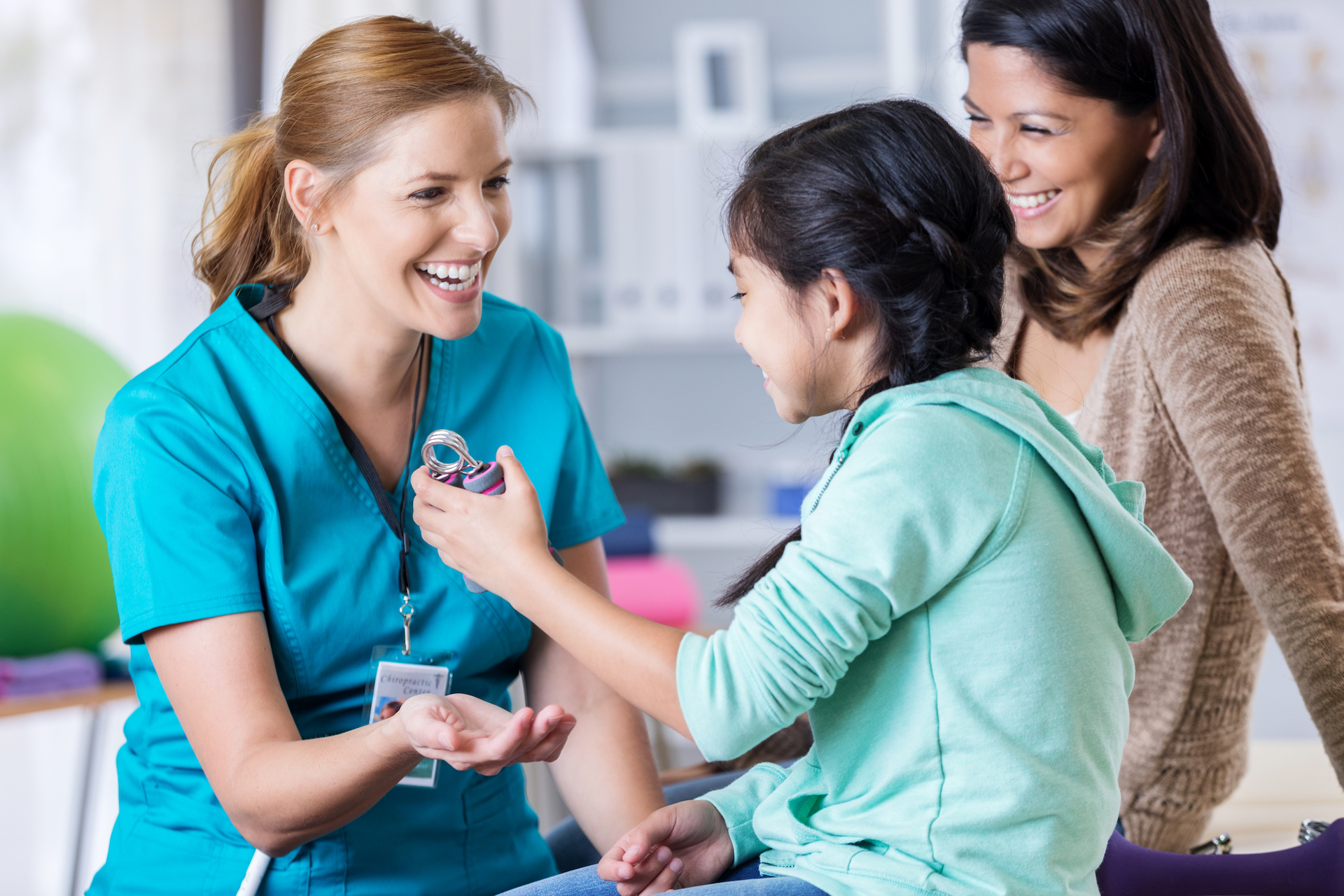 nurse assisting child with smiles