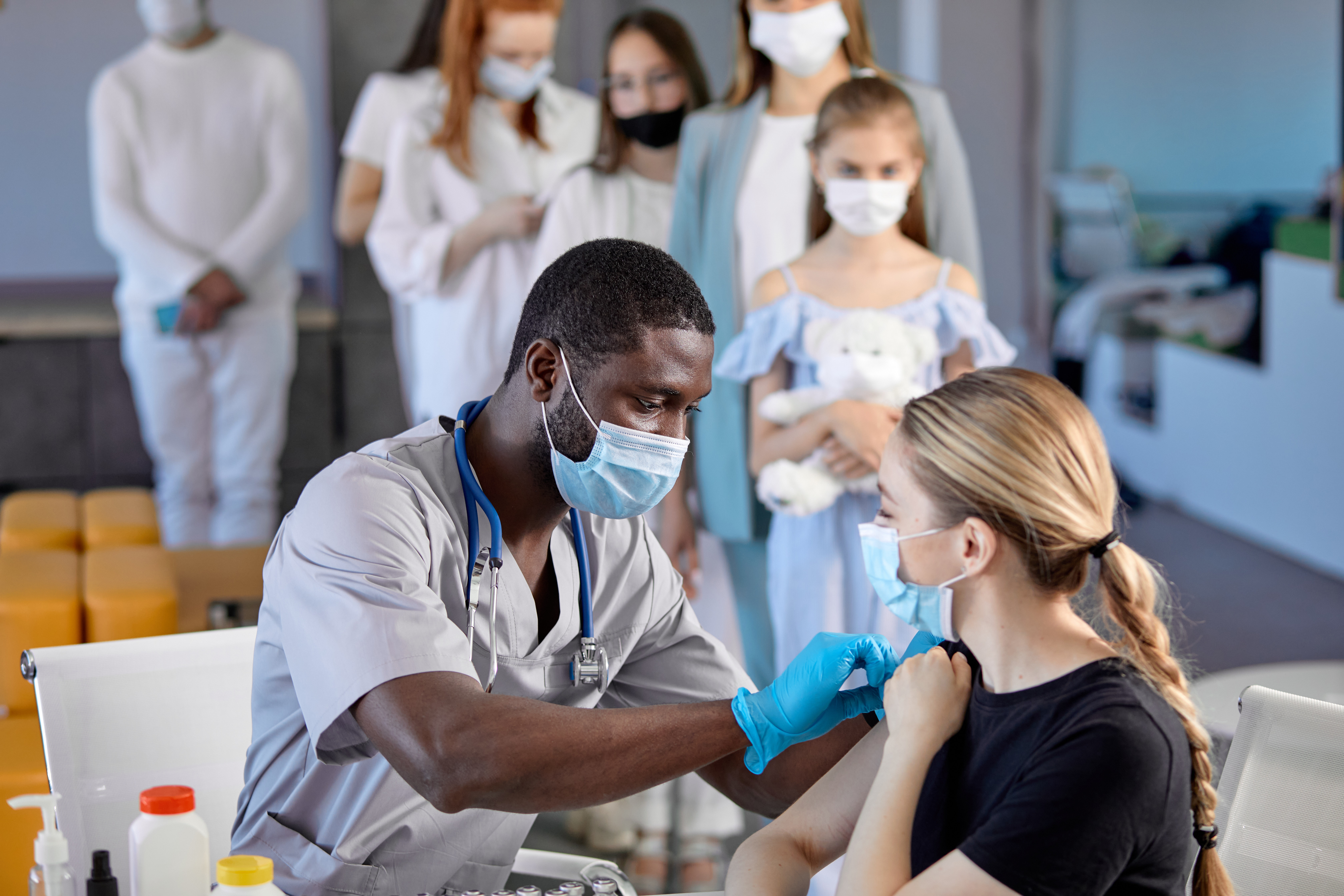 Man Giving A Woman A Vaccine